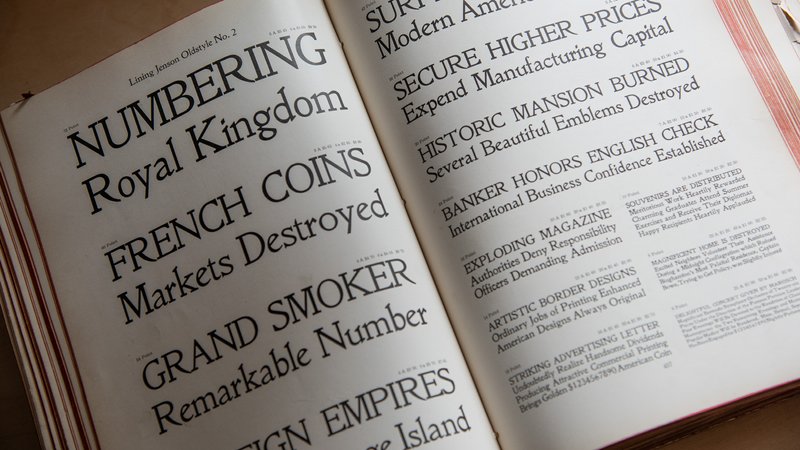 The 1912 American Type Founders catalog rests open to a spread showing the typeface Jenson Oldstyle