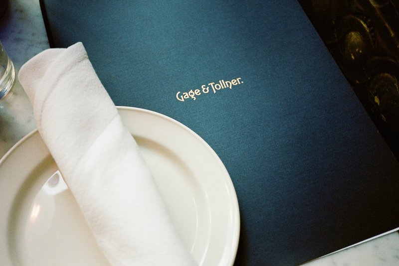 A napkin on a plate over a menu