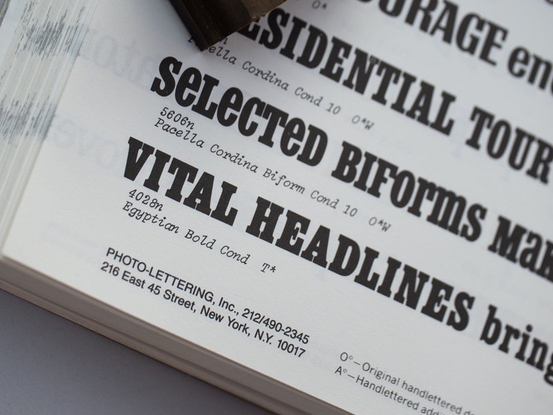 A close crop of the Photo-Lettering catalog, showing a line of type in the "Egyptian Bold Cond" style