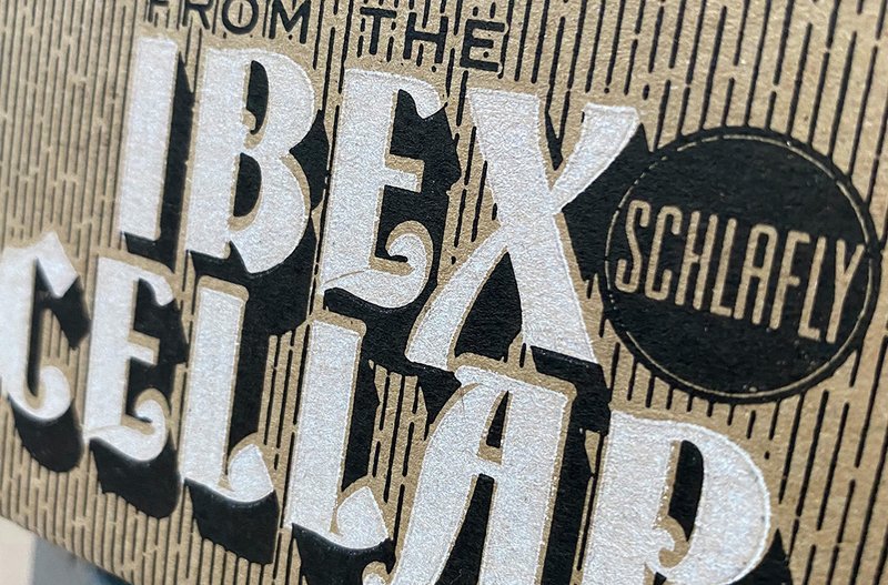A perspective photo of "From the Ibex Cellar" on a cardboard six-pack sleeve