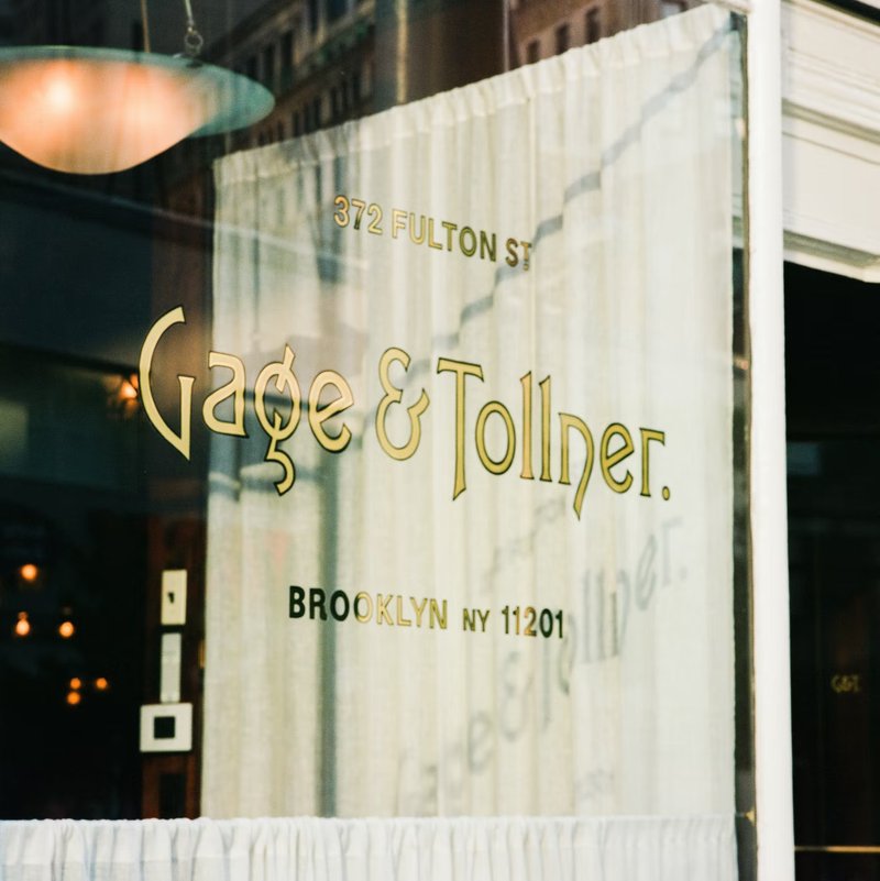 Gilded lettering on a window, "Gage & Tollner"