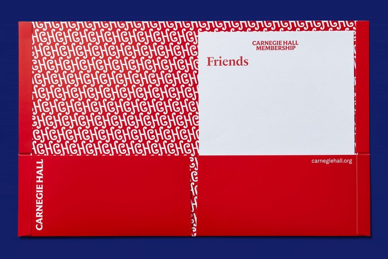 A red folder with the CH pattern inside