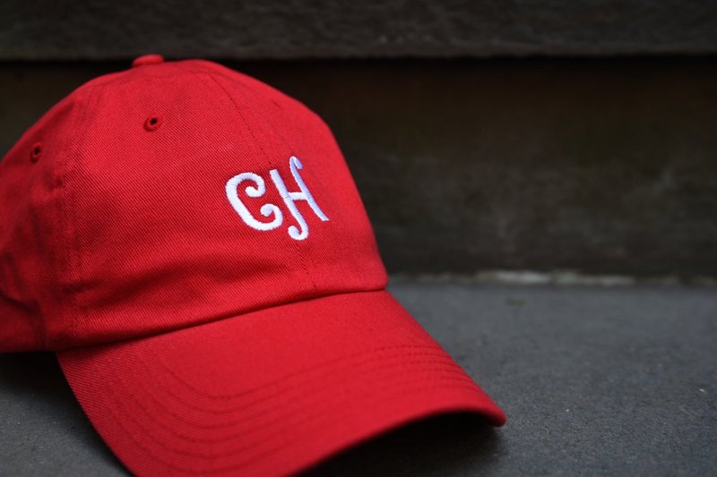 A hat with the CH monogram embroidered on it